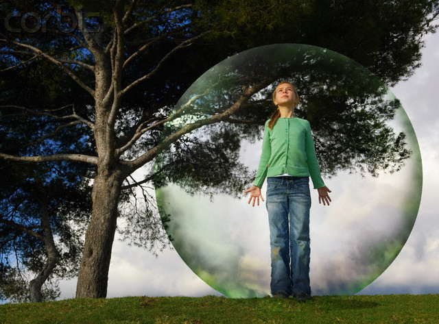 Girl in a bubble --- Image by © Ben Welsh/Corbis