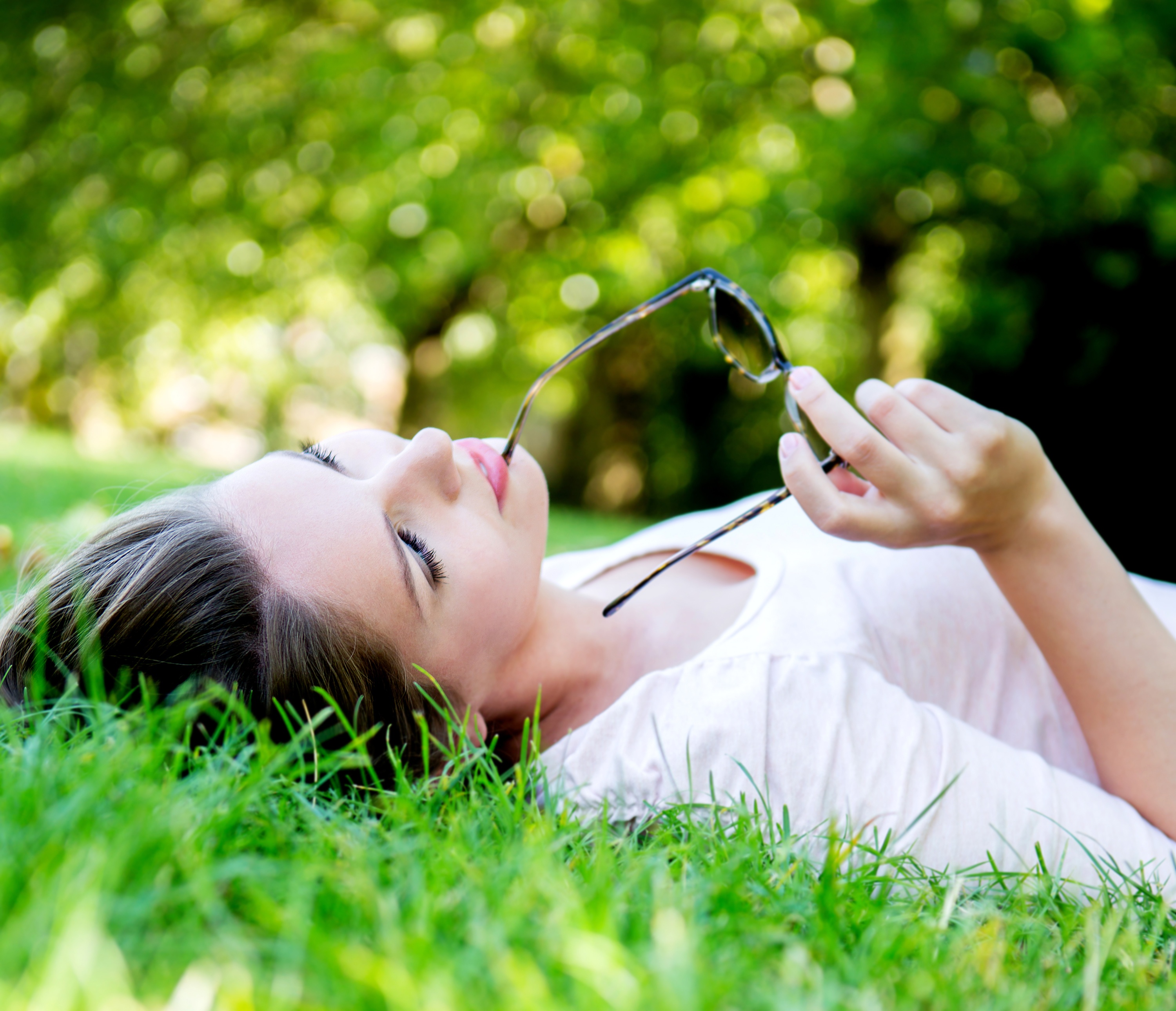 Woman-relaxing-in-the-grass